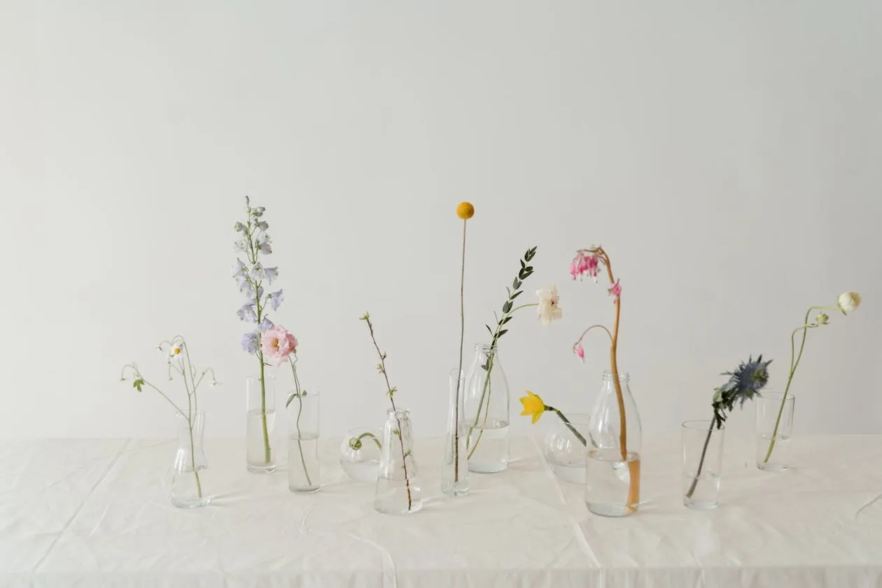 A colourful flower arrangement in a clear glass vase with fresh water